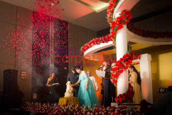 flower shower for cake cutting ceremony | Betrothal by Red Carpet Events - Hotel Crowne Plaza Maradu Kochi Kerala
